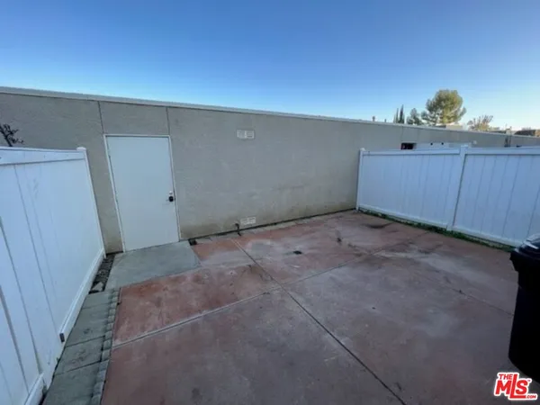 an empty room with wooden floor