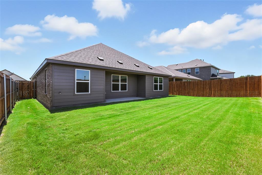1795 Gleasondale Place Forney, TX 75126 - Photo 27 of 29 Back of property with a patio area, a fenced backyard, a shingled roof, and brick siding