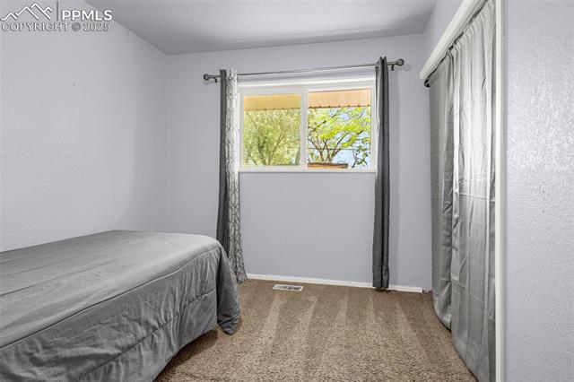 605 Huron Road Colorado Springs, CO 80910 - Photo 12 of 30 Carpeted bedroom with baseboards