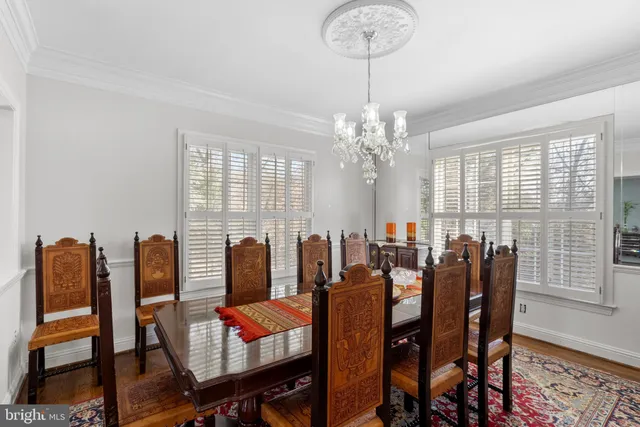 a kitchen with kitchen island granite countertop stainless steel appliances a stove sink and microwave