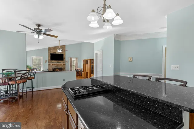 a view of staircase with railing and white walls