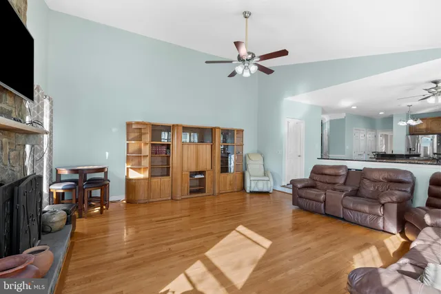 a large white kitchen with a white countertops a cabinets and a window