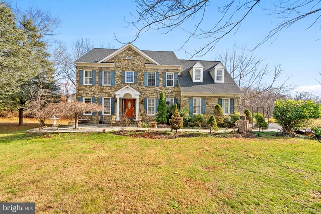 a front view of a house with swimming pool