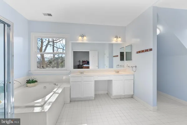 a white toilet sitting next to a bathroom sink