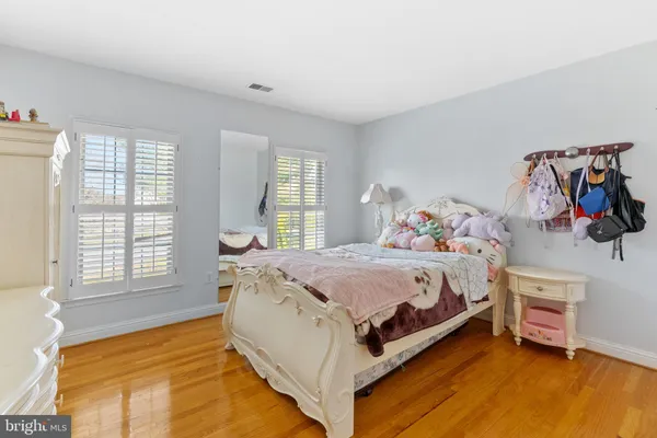a bedroom with a bed and a table