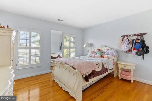 a bedroom with a bed and a table