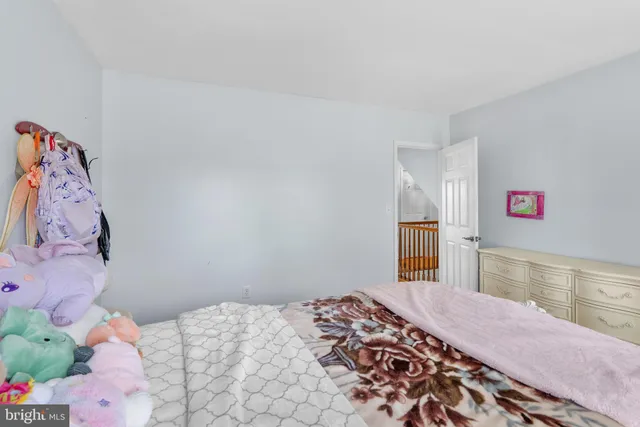 a view of a house with swimming pool and sitting area