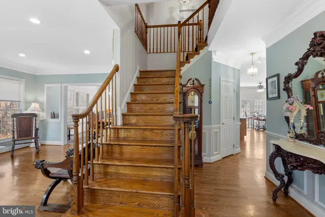 a view of entryway with a front door and wooden floor