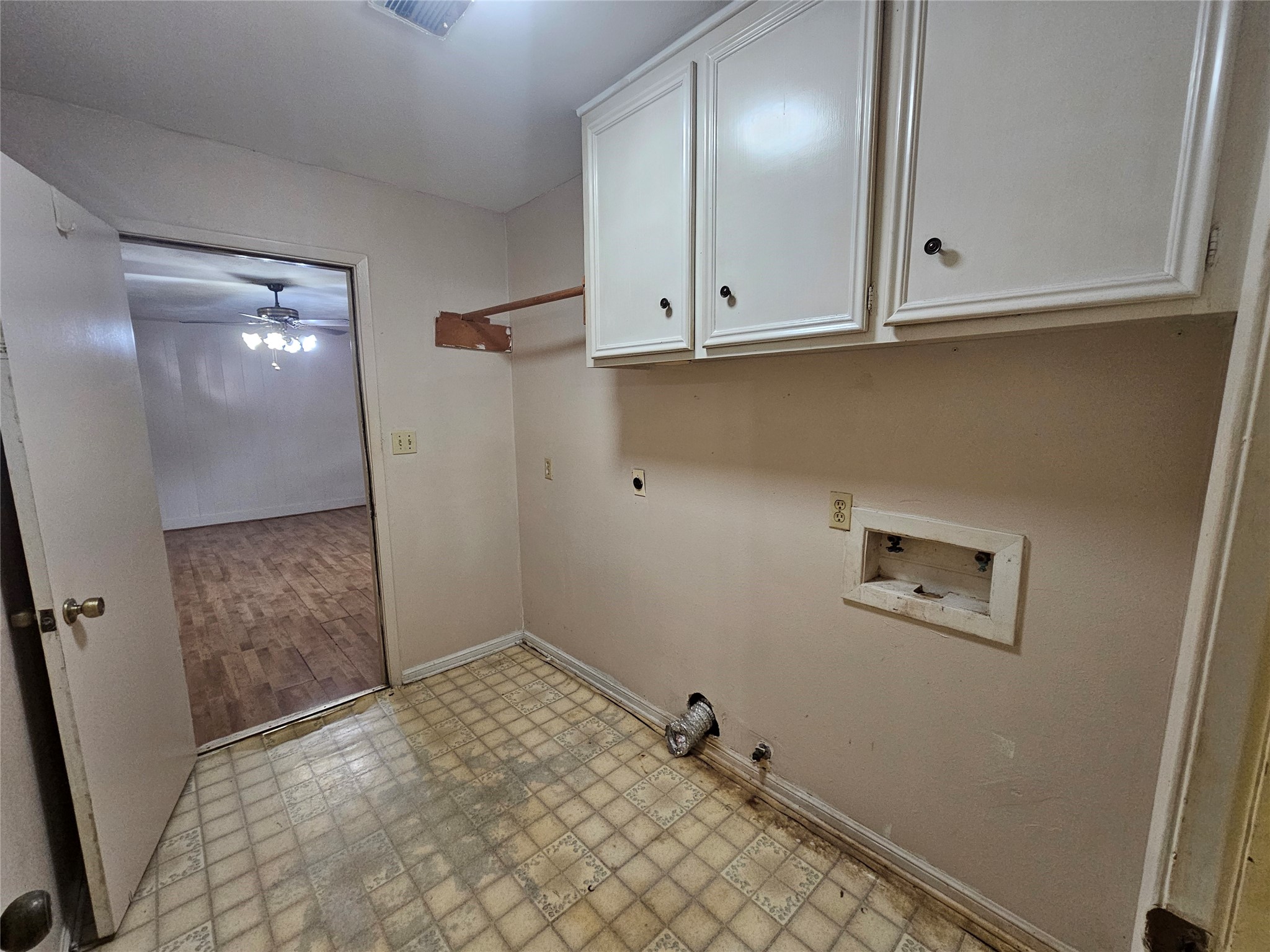 1802 Junker Street Rosenberg, TX 77471 - Photo 11 of 13 a view of kitchen with white cabinets and wooden floor