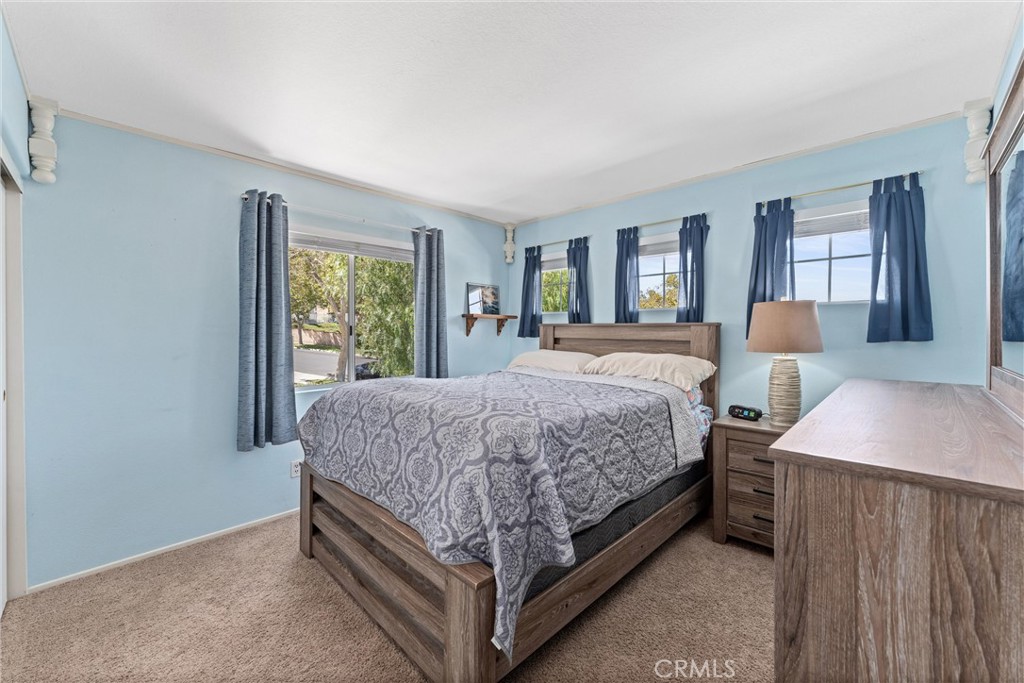 4150 San Ramon Drive Corona, CA 92882 - Photo 17 of 30 a bed sitting in a bedroom next to a window