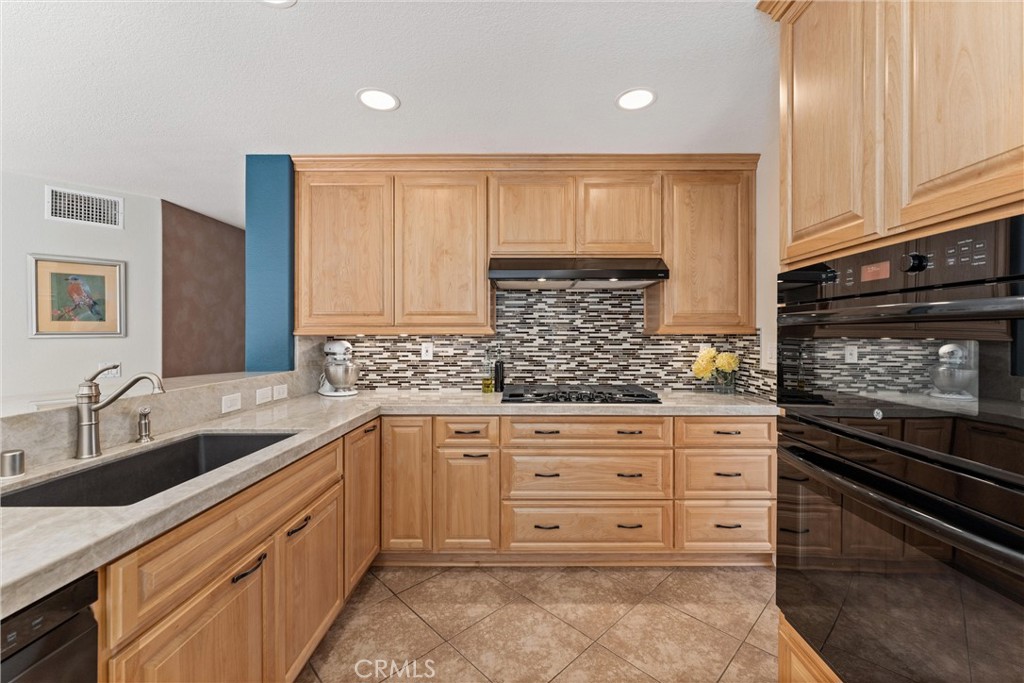 4150 San Ramon Drive Corona, CA 92882 - Photo 2 of 30 a kitchen with stainless steel appliances granite countertop a sink and cabinets