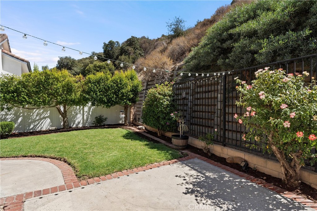 4150 San Ramon Drive Corona, CA 92882 - Photo 25 of 30 a view of a garden with a pathway