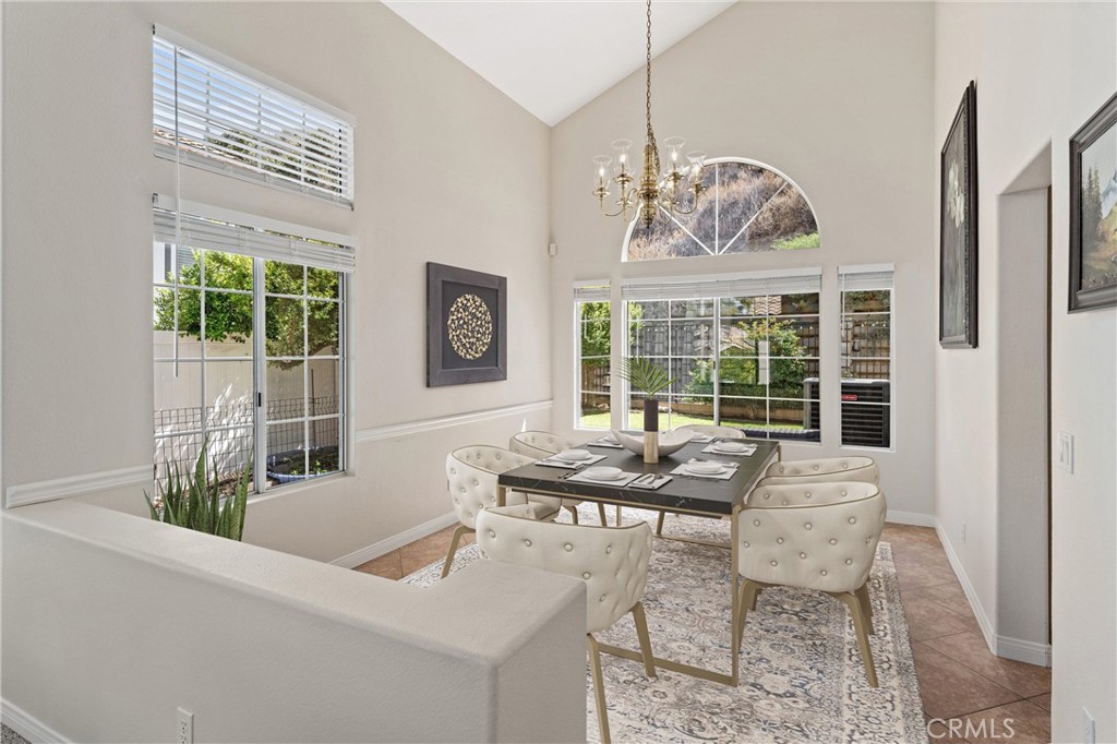 4150 San Ramon Drive Corona, CA 92882 - Photo 3 of 30 a dining room with furniture a chandelier and wooden floor