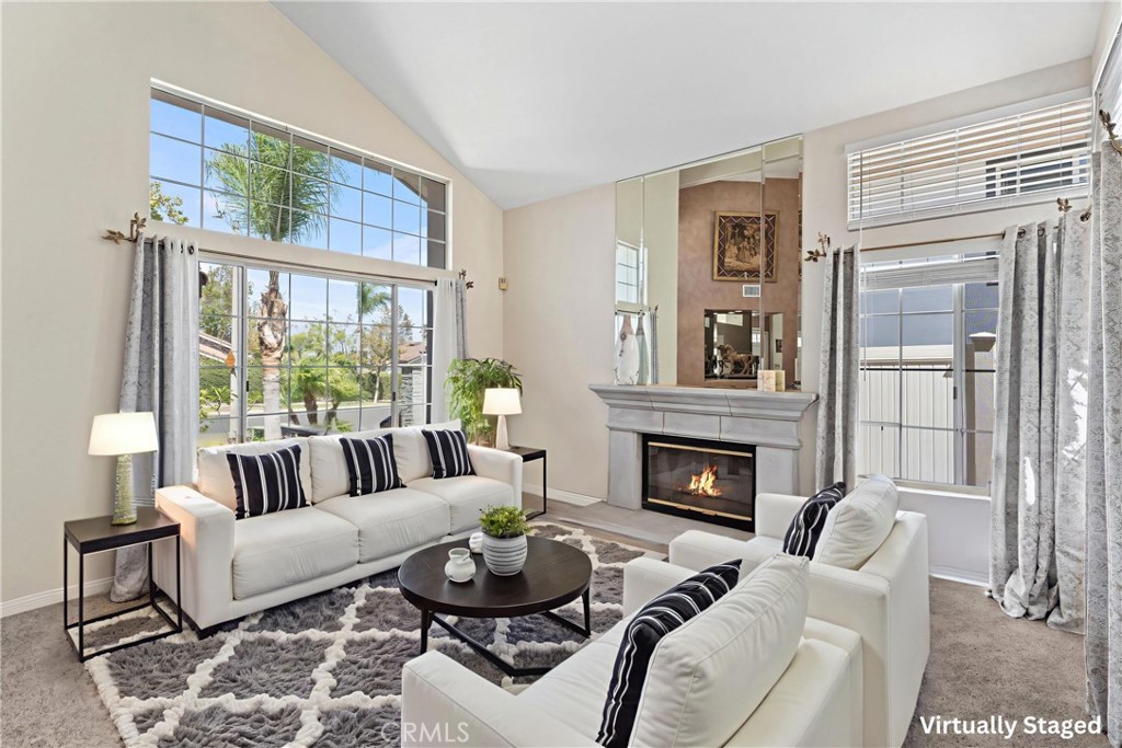 4150 San Ramon Drive Corona, CA 92882 - Photo 6 of 30 a living room with furniture a fireplace and a large window