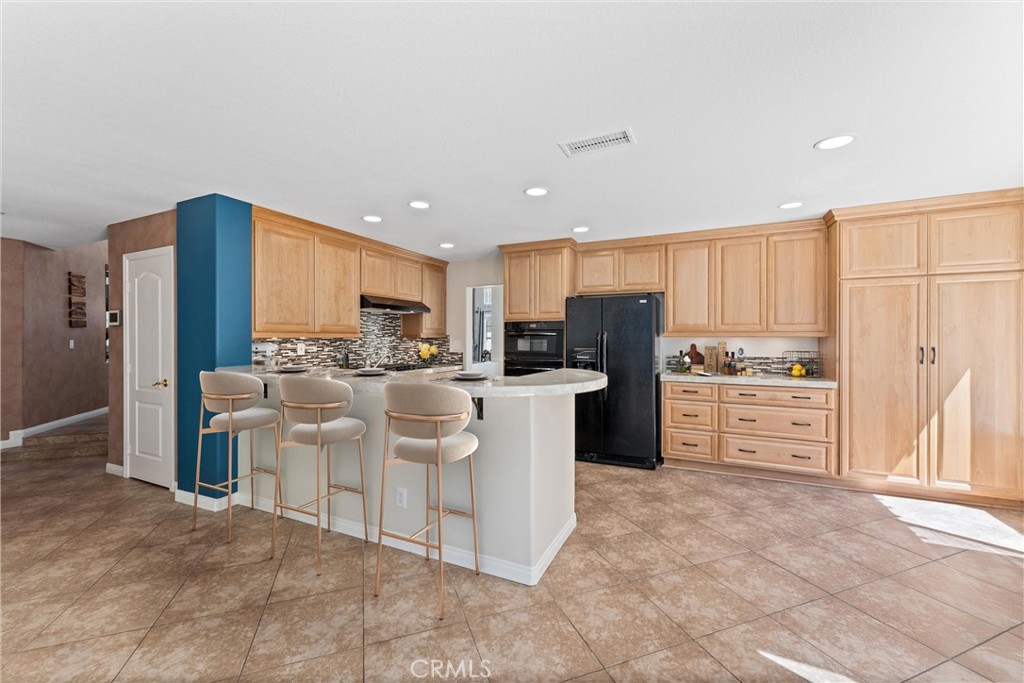 4150 San Ramon Drive Corona, CA 92882 - Photo 10 of 30 a kitchen with white cabinets and stainless steel appliances