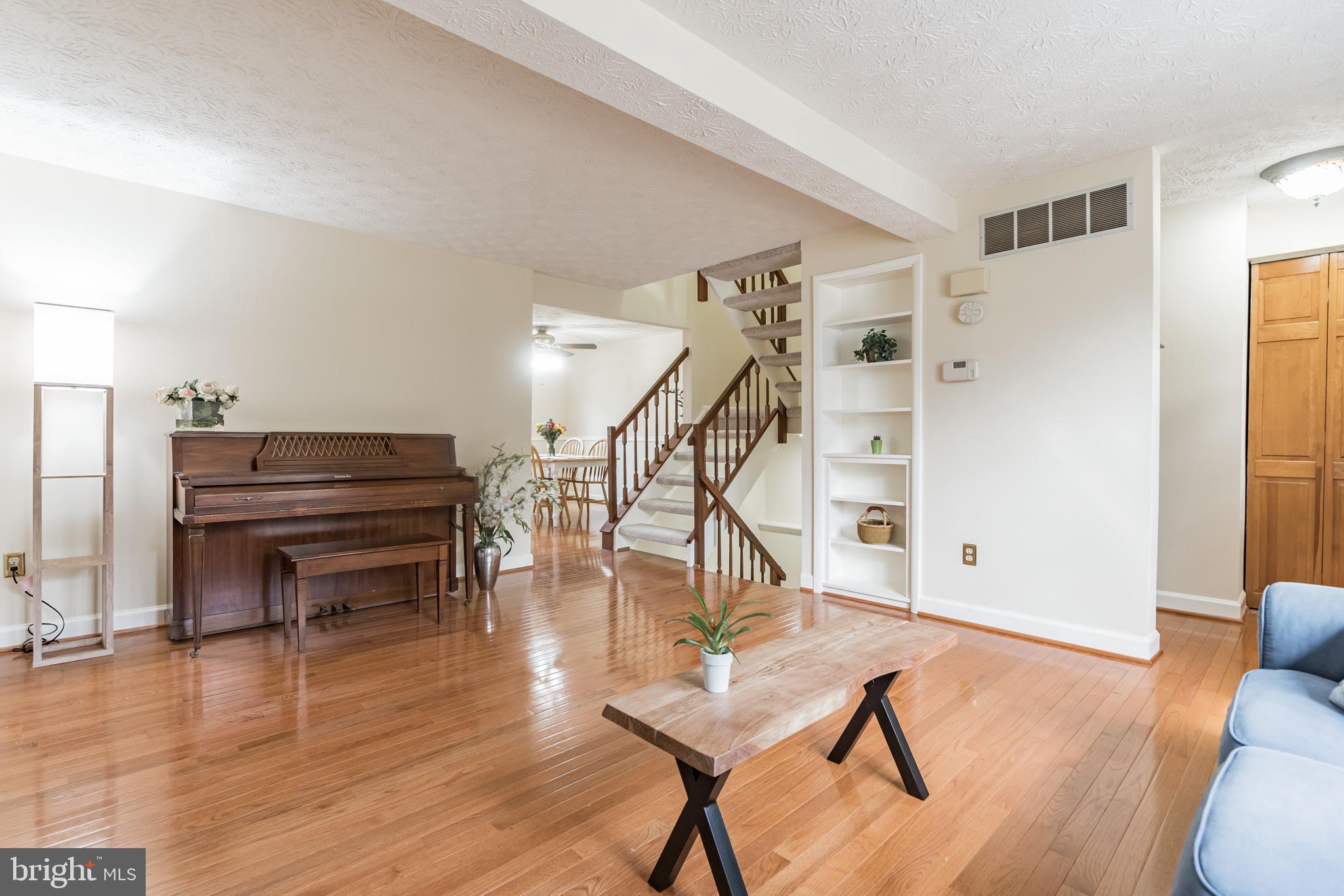 1610 Barnstead Drive Reston, VA 20194 - Photo 5 of 33 a livingroom with furniture and staircase
