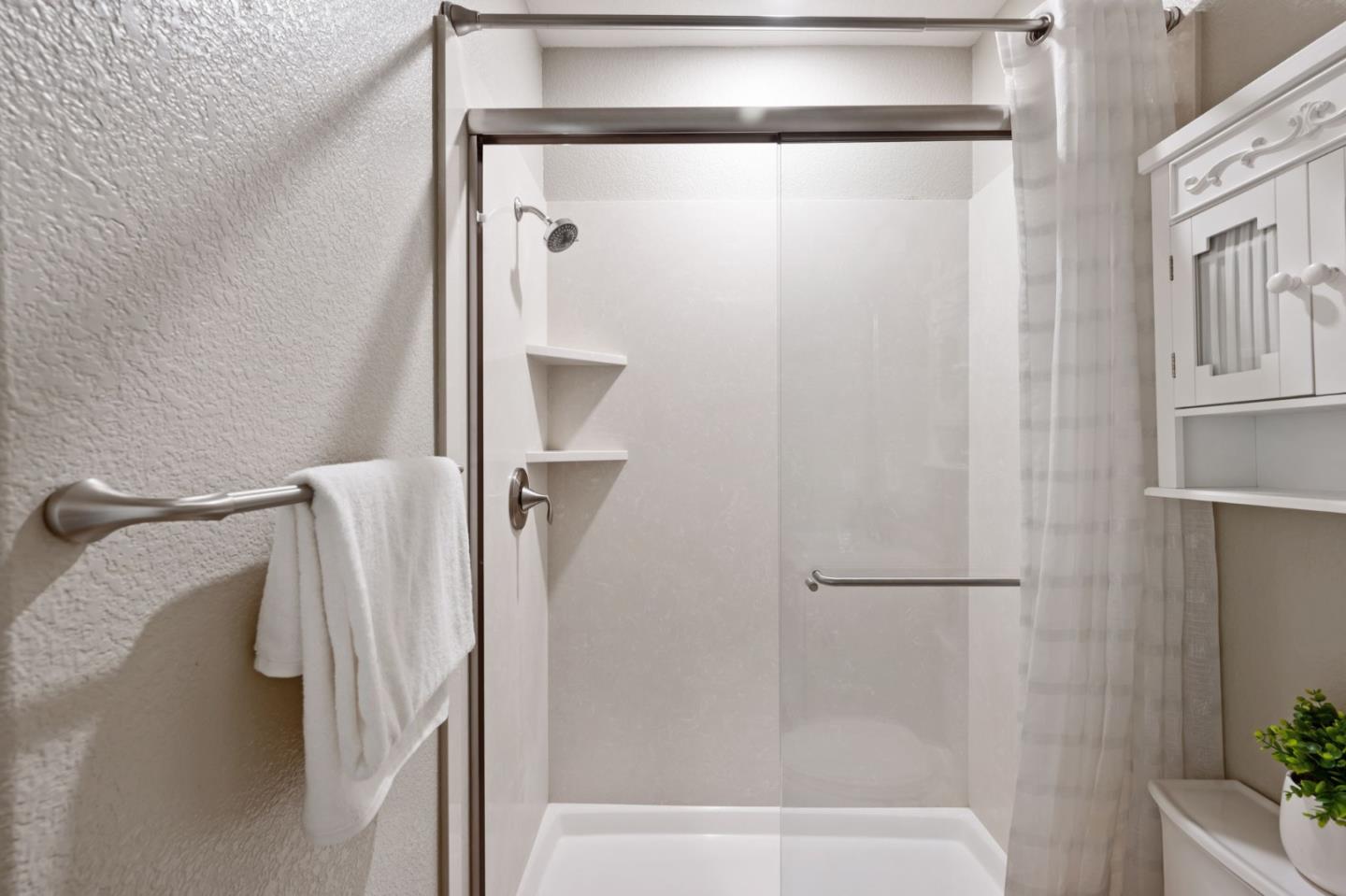 5977 Larkstone Loop San Jose, CA 95123 - Photo 38 of 63 a bathroom with a shower