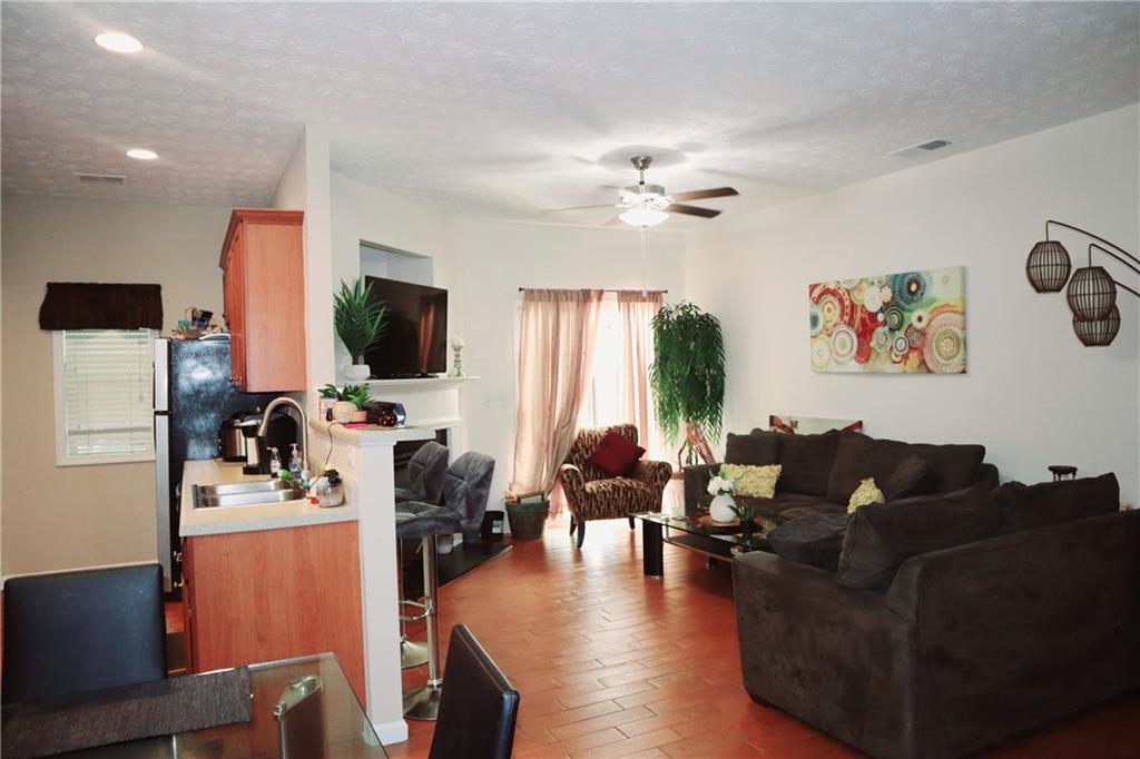 789 Celeste Lane Atlanta, GA 30331 - Photo 4 of 18 a living room with furniture flat screen tv and a window