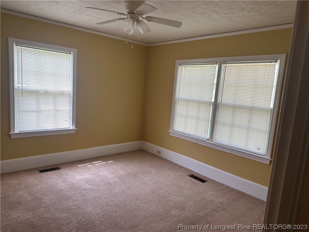 202 North Bethel Road Raeford, NC 28376 - Photo 10 of 15 an empty room with a window