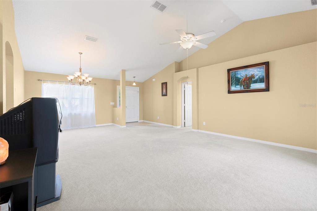 17083 Southeast 115th Terrace Road Summerfield, FL 34491 - Photo 13 of 43 a view of a livingroom with a chandelier fan