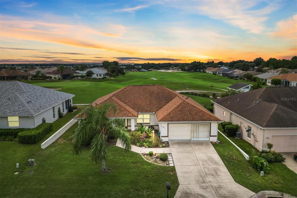 17083 Southeast 115th Terrace Road Summerfield, FL 34491 - Photo 2 of 43 an aerial view of house with yard and mountain view in back