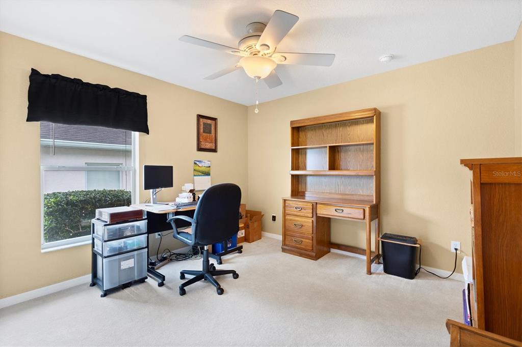 17083 Southeast 115th Terrace Road Summerfield, FL 34491 - Photo 27 of 43 a view of a workspace with furniture and a window