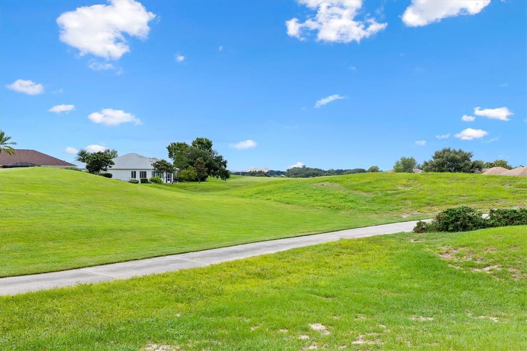 17083 Southeast 115th Terrace Road Summerfield, FL 34491 - Photo 34 of 43 a view of a golf course with a lake