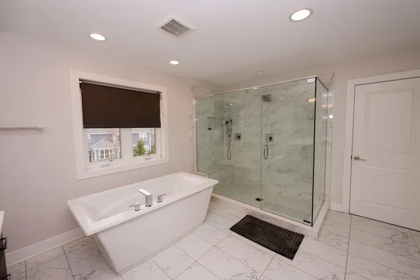 a bathroom with a sink toilet and a mirror
