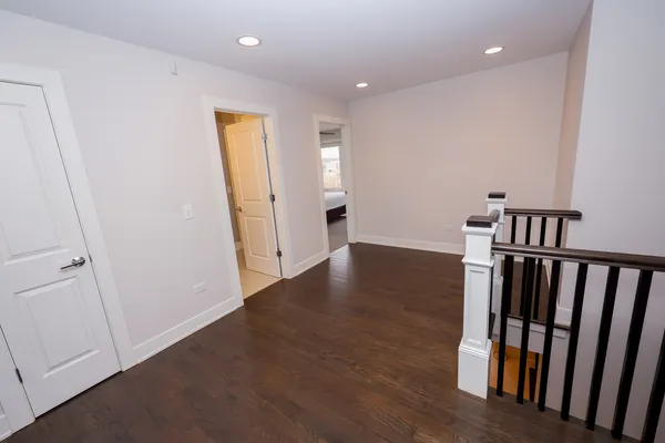 a view of an entryway with wooden floor