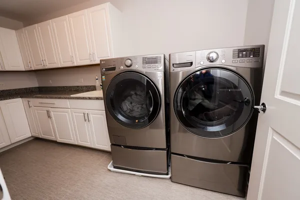 a room with gym equipment and a flat screen tv