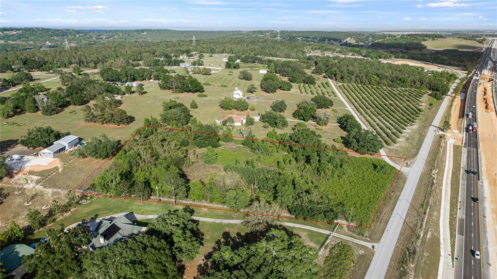 Turnpike Road Clermont, FL 34715 - Photo 2 of 7 an aerial view of residential houses with outdoor space and trees