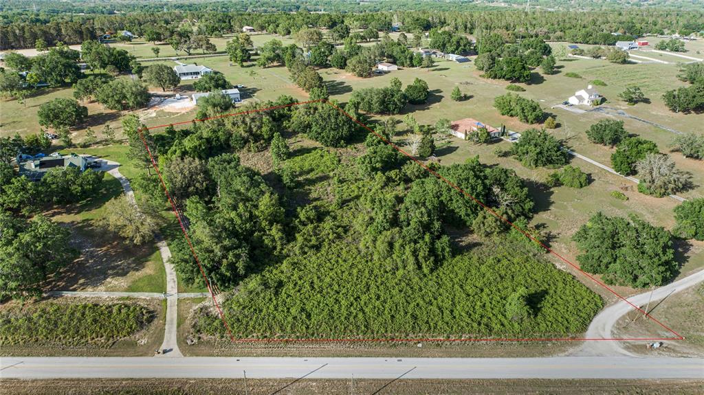 Turnpike Road Clermont, FL 34715 - Photo 3 of 7 an aerial view of a house with a yard