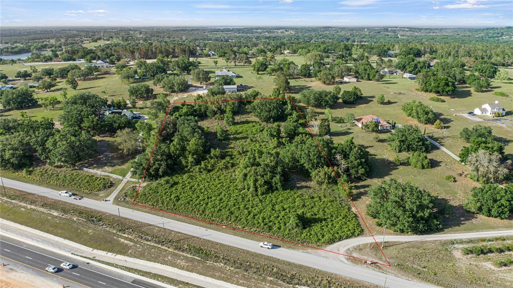 Turnpike Road Clermont, FL 34715 - Photo 4 of 7 an aerial view of green landscape with trees