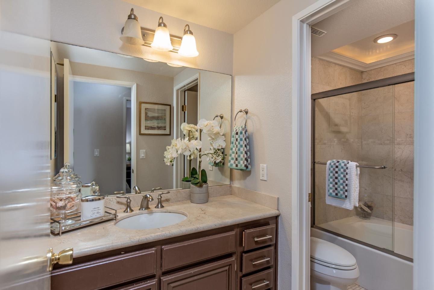 2071 Foxhall Loop San Jose, CA 95125 - Photo 13 of 17 a bathroom with a granite countertop sink a toilet and shower