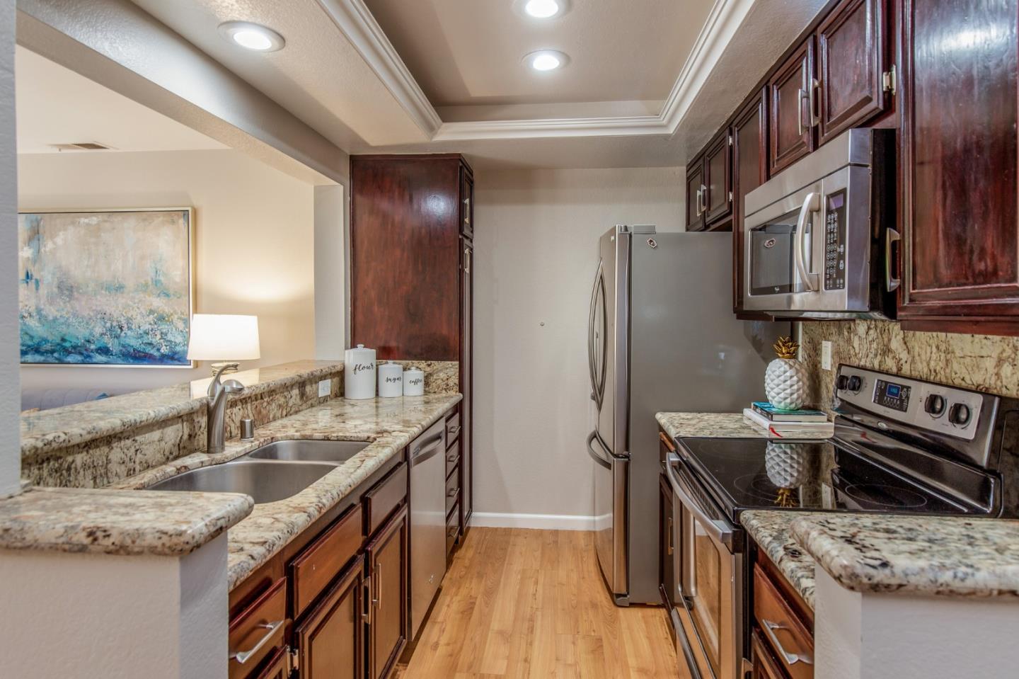 2071 Foxhall Loop San Jose, CA 95125 - Photo 7 of 17 a kitchen with stainless steel appliances granite countertop a sink stove and refrigerator