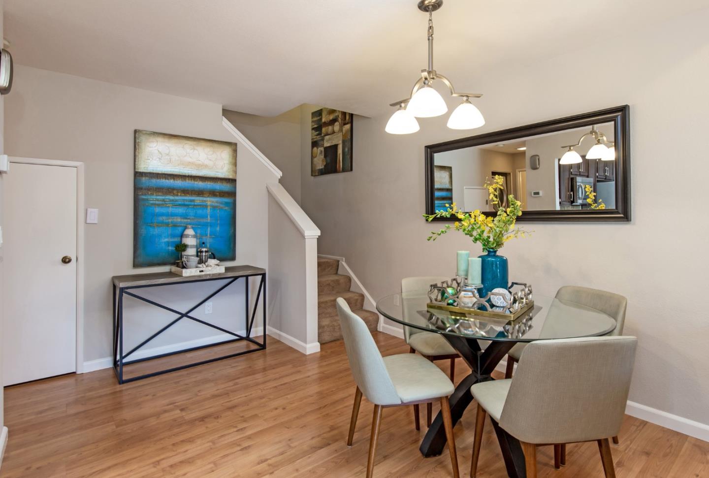 2071 Foxhall Loop San Jose, CA 95125 - Photo 8 of 17 a dining room with furniture potted plants and wooden floor