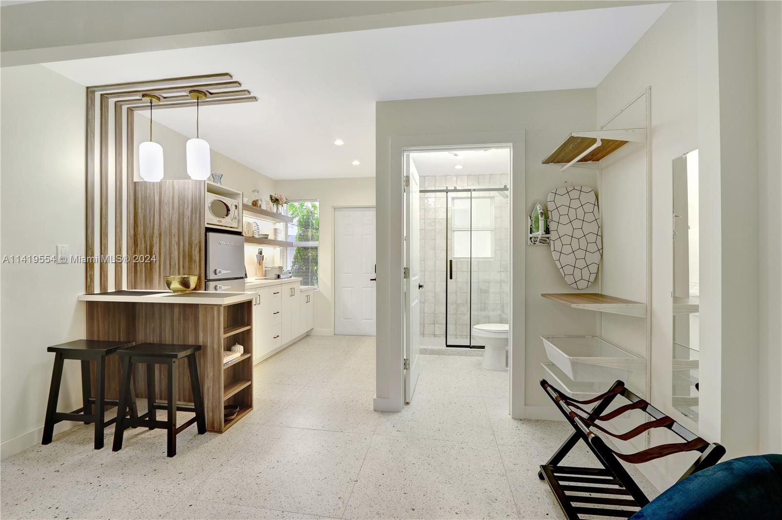 Palm Trail Delray Beach, FL 33483 - Photo 20 of 55 a room with furniture and a window