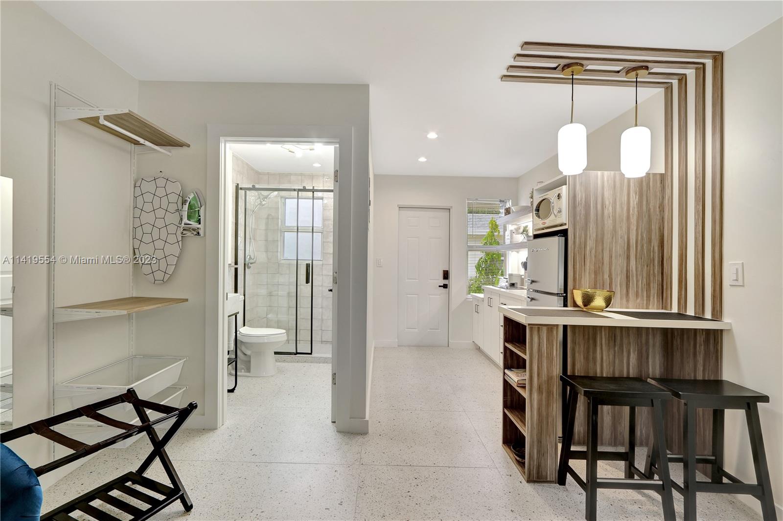 Palm Trail Delray Beach, FL 33483 - Photo 24 of 55 a view of a dining room with furniture and a chandelier