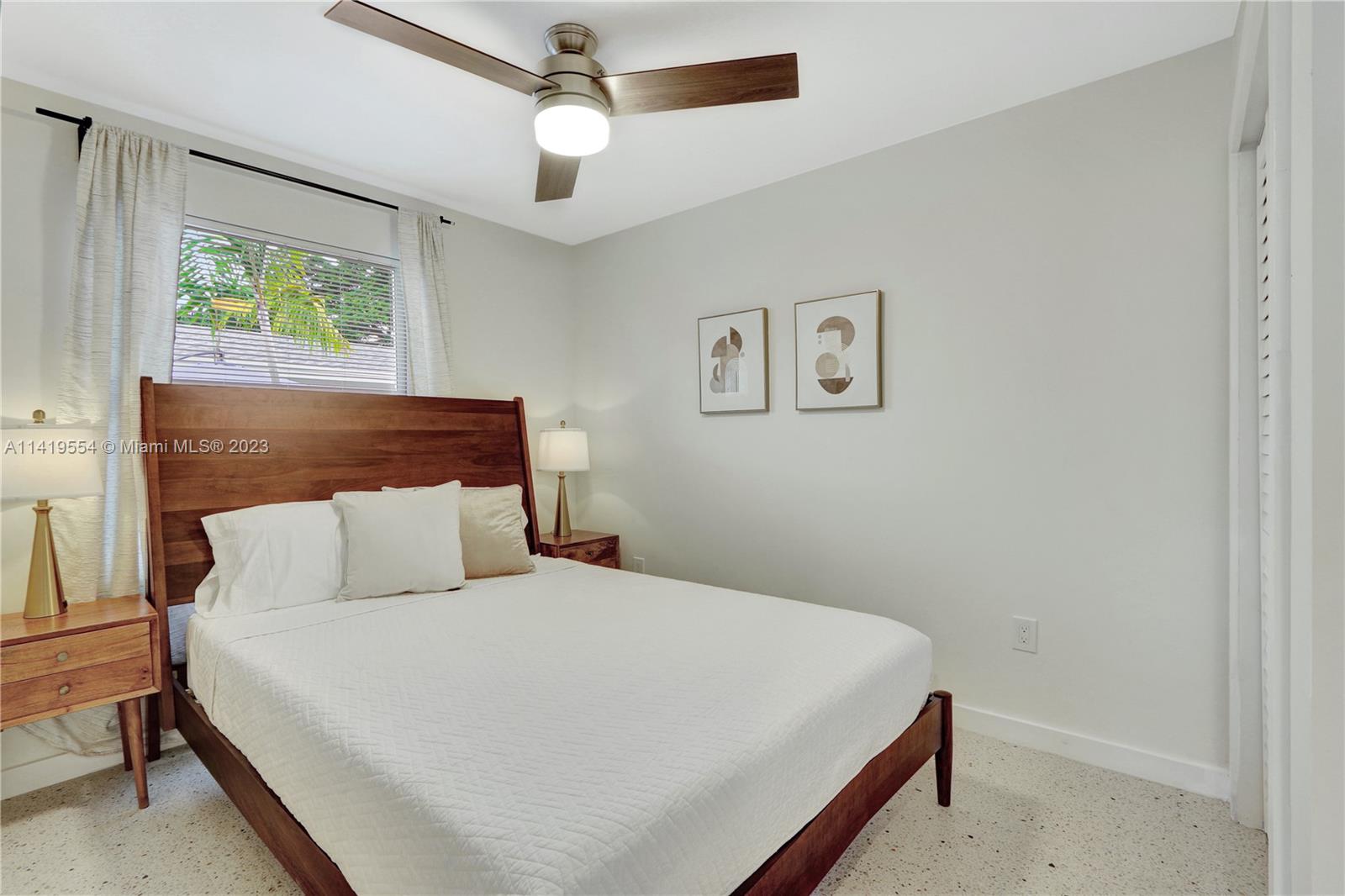 Palm Trail Delray Beach, FL 33483 - Photo 34 of 55 a bedroom with a bed and a window