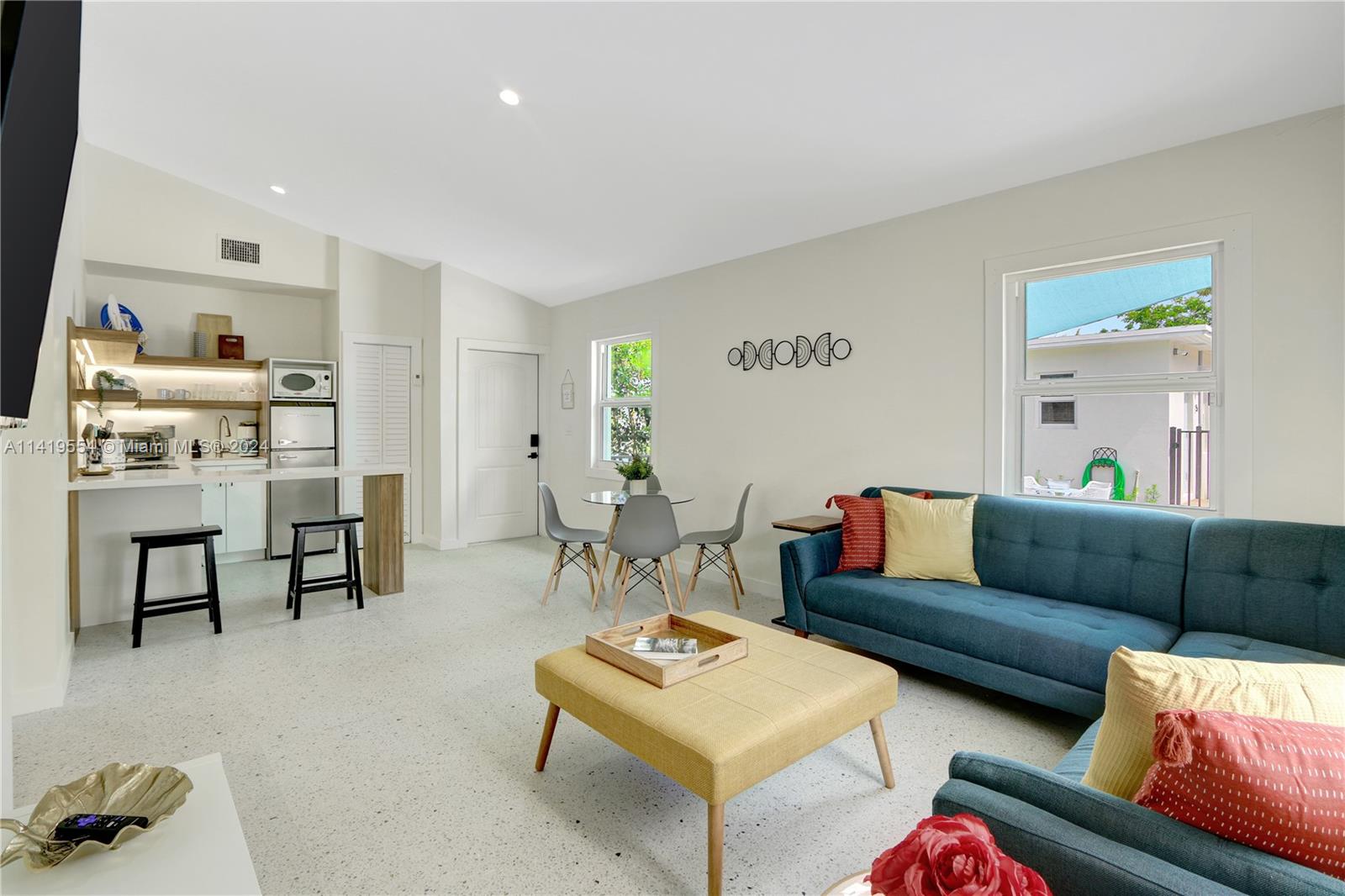 Palm Trail Delray Beach, FL 33483 - Photo 37 of 55 a living room with furniture and a table