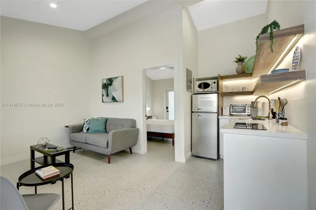 a living room with furniture and a table