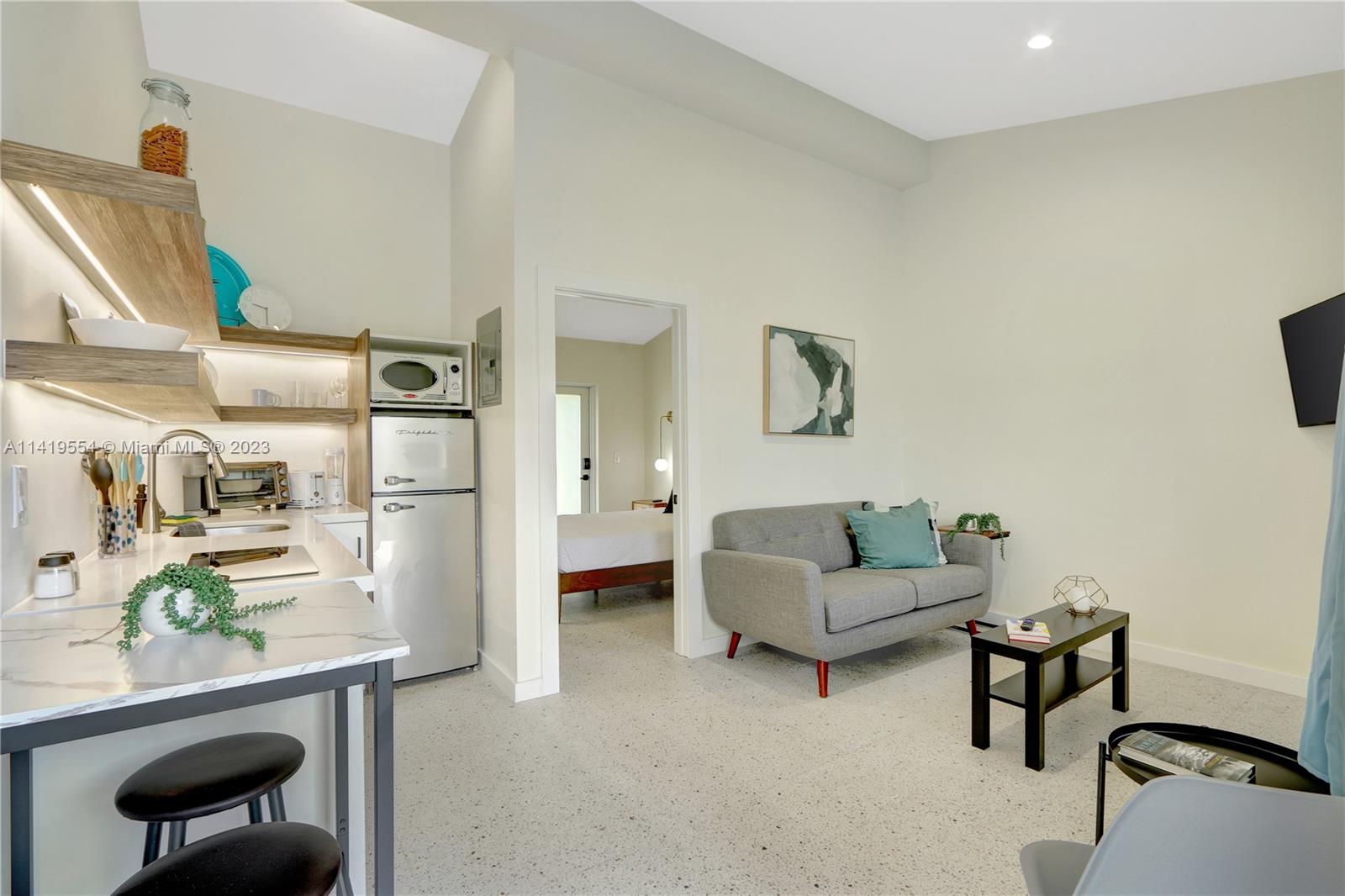 Palm Trail Delray Beach, FL 33483 - Photo 46 of 55 a living room with furniture and a table