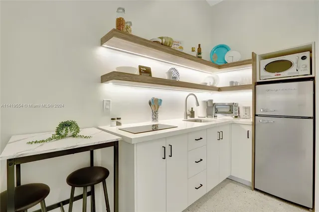 a view of a livingroom with furniture and window