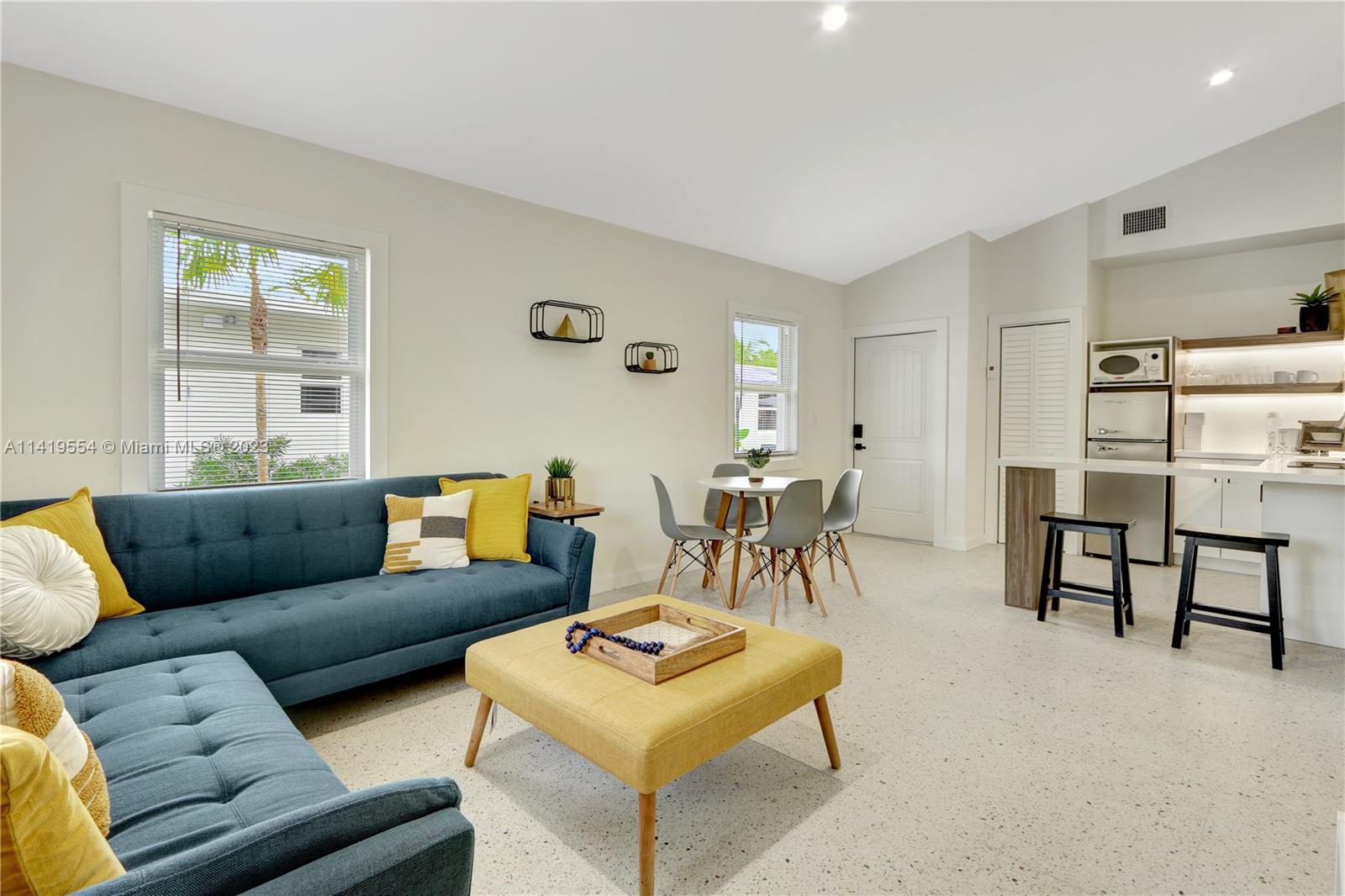 Palm Trail Delray Beach, FL 33483 - Photo 50 of 55 a living room with furniture and a table