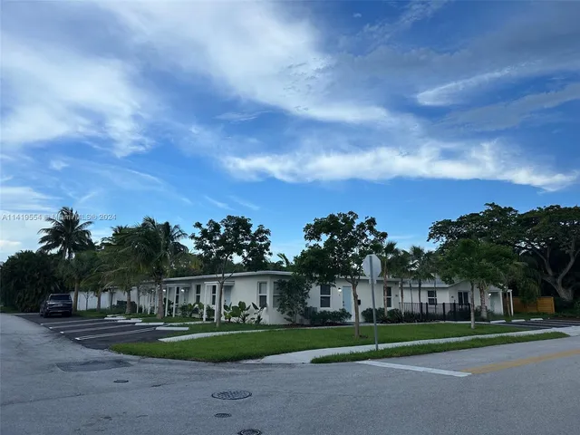 a house with trees in front of it