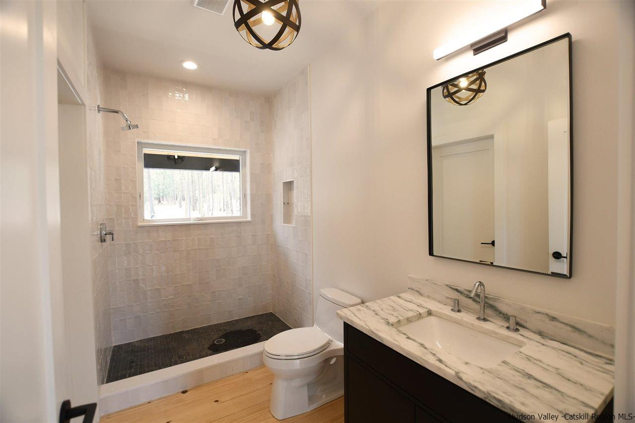 44 Krom Road Olivebridge, NY 12461 - Photo 12 of 33 a bathroom with a granite countertop sink toilet and shower