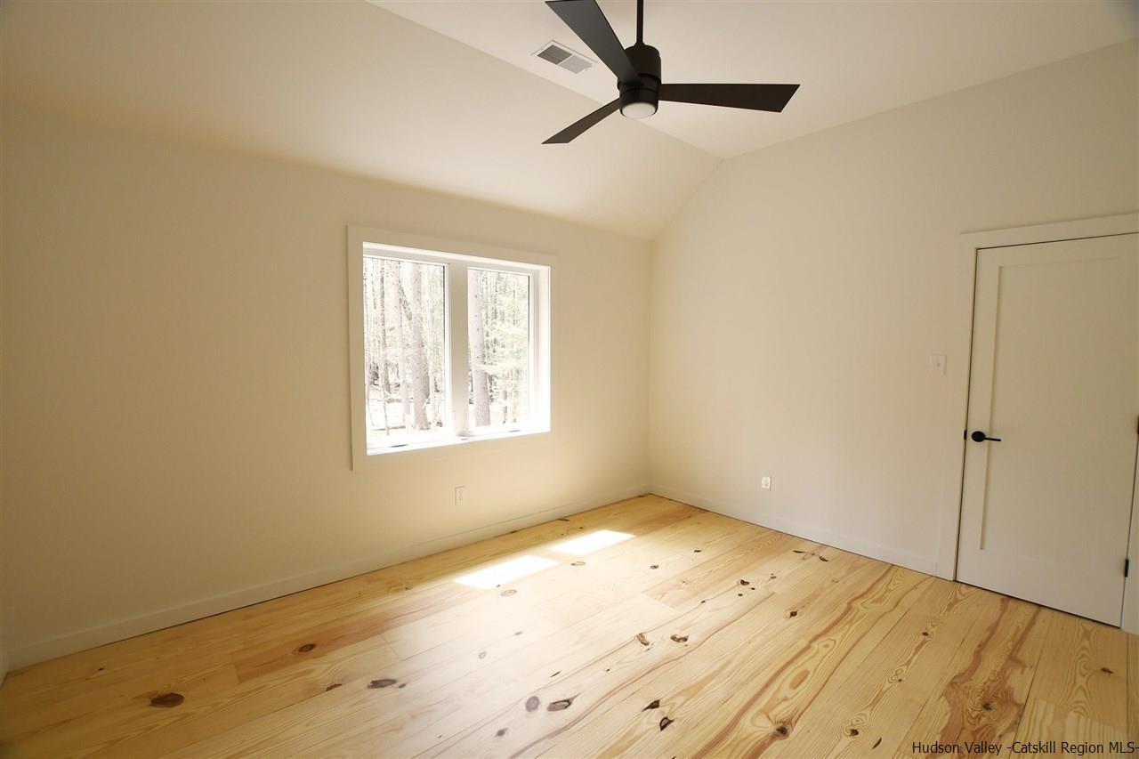 44 Krom Road Olivebridge, NY 12461 - Photo 16 of 33 a view of empty room with wooden floor and fan