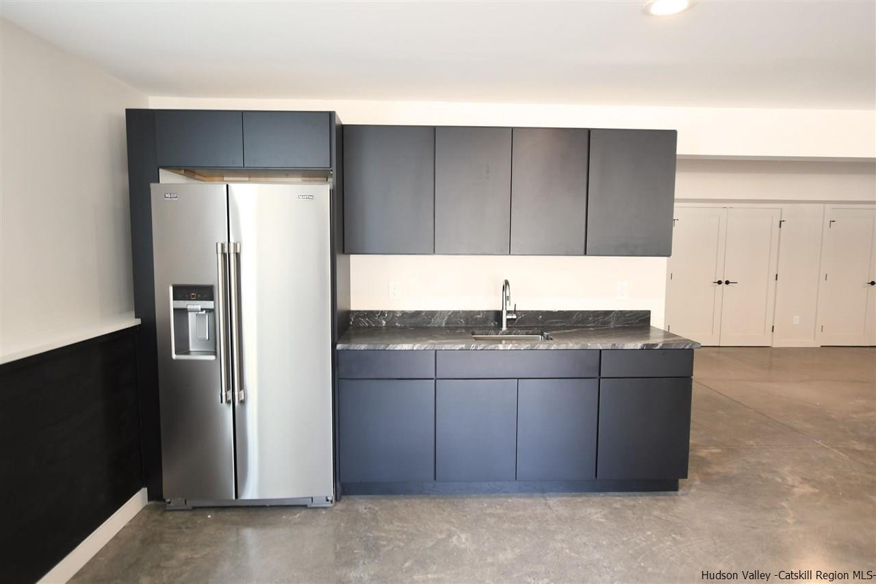 44 Krom Road Olivebridge, NY 12461 - Photo 23 of 33 a kitchen with granite countertop a refrigerator and a sink