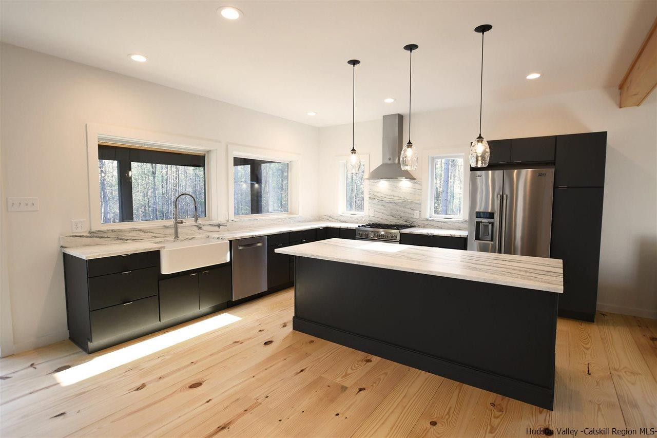 44 Krom Road Olivebridge, NY 12461 - Photo 7 of 33 a large kitchen with kitchen island a sink stainless steel appliances and cabinets