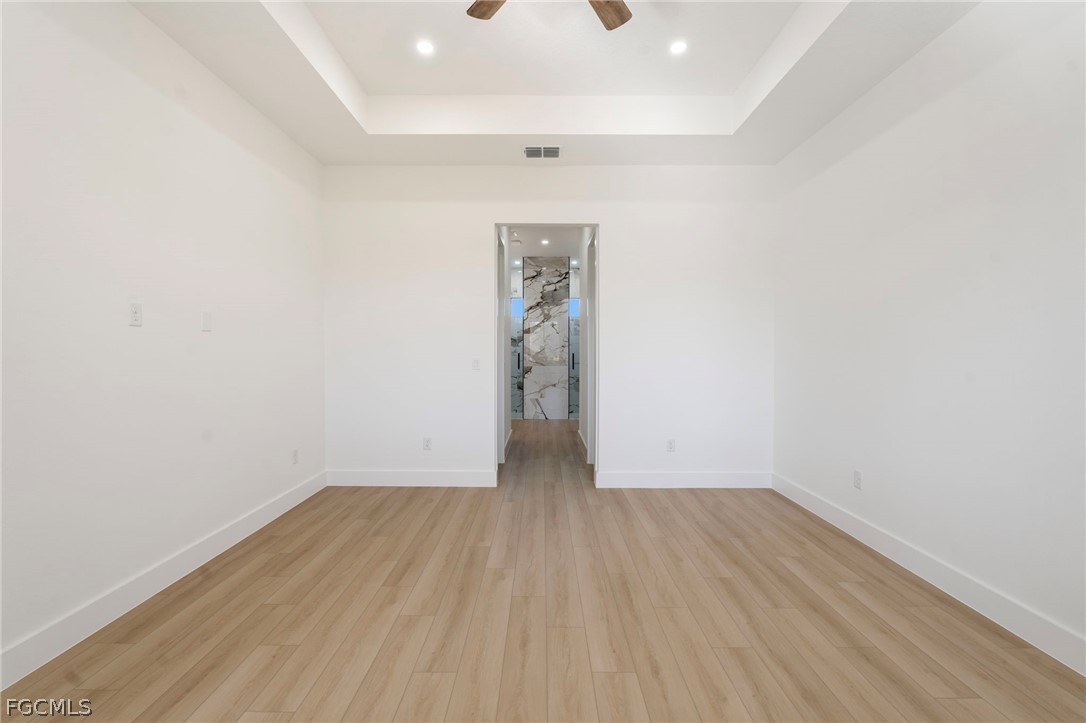 95 Brig Circle East Placida, FL 33946 - Photo 16 of 25 an empty room with wooden floor and windows